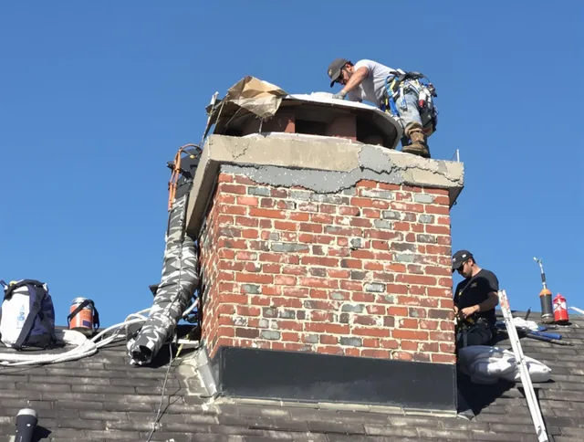 Lynwood Chimney Sweep installing a custom chimney crown in Lynwood, CA