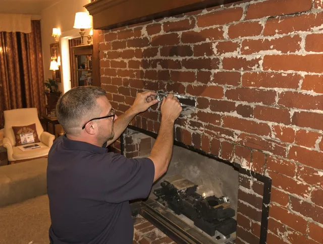 Lynwood Chimney Sweep expert fixing a fireplace in Lynwood, CA